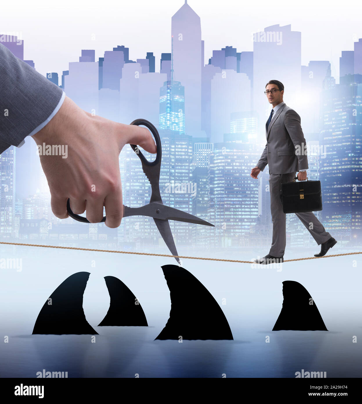 Hand Cutting Rop The hand cutting rope in business risk concept Stock Photo - Alamy