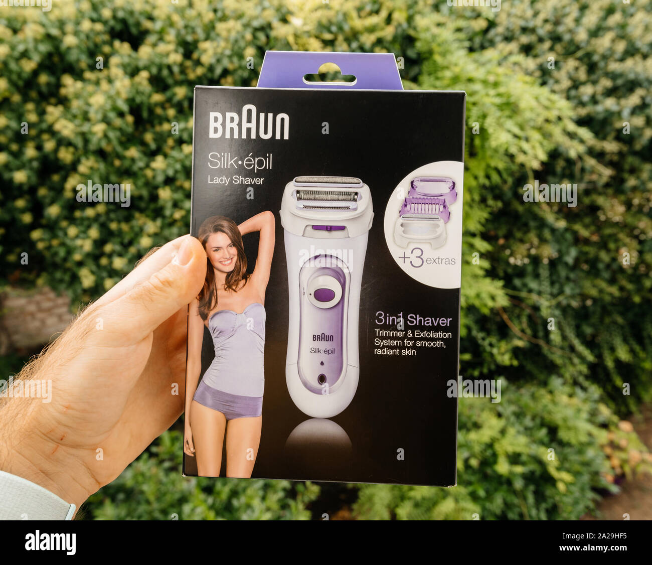 Paris, France - Sep 23, 2019: POV man hand new Braun Silk Epil women lady  shaver epilator 3 in 1 trimmer, exfoliation system for smooth and radiant  skin - green background Stock Photo - Alamy