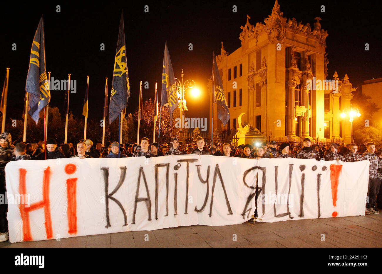 Ukrainian nationalists of National Corps political party hold a banner saying No capitulation during the protest against adoption the so-called Steinmeier formula outside the Presidential Office in Kiev.President of Ukraine Volodymyr Zelensky said on today’s press-conference that the Ukrainian side at the talks of the Trilateral Contact Group in Minsk responded to a letter from the OSCE Special Representative Martin Saydik, and agreed with the so-called Steinmeier formula, reportedly by media. Stock Photo