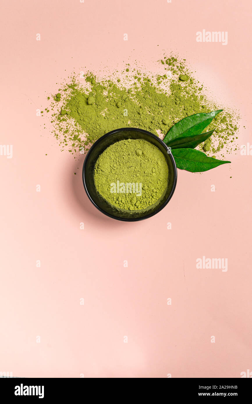 Matcha green tea powder close up on colored background Stock Photo Alamy