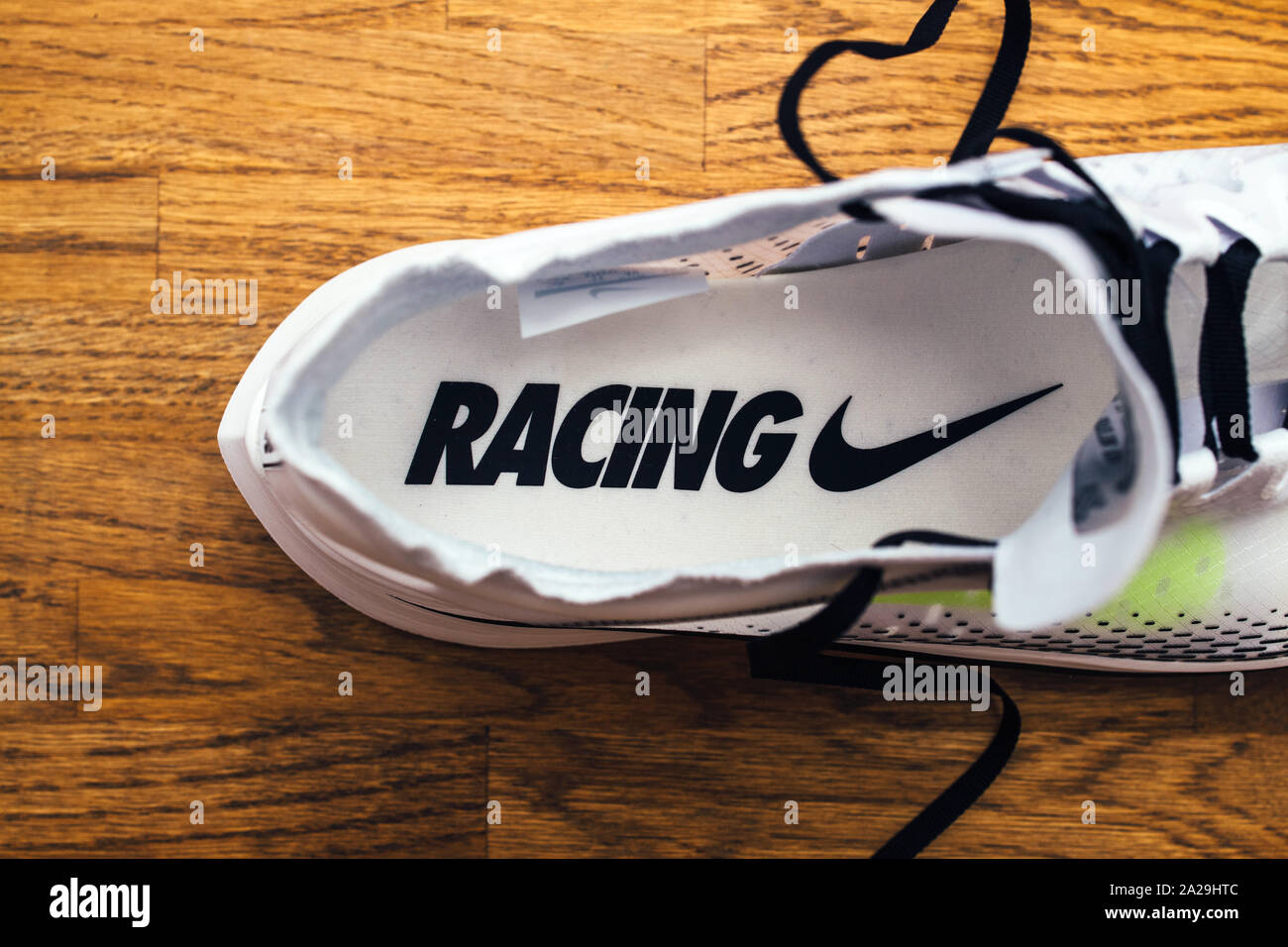 Paris, France - Jul 8, 2019: New professional Nike Zoom Fly SP Fast running  sport shoe on wooden floor with Racing inscription on the sole Stock Photo  - Alamy