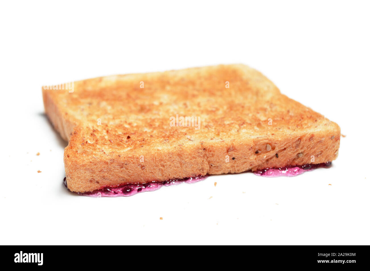 Bread falls buttered side down, isolated on white Stock Photo Alamy