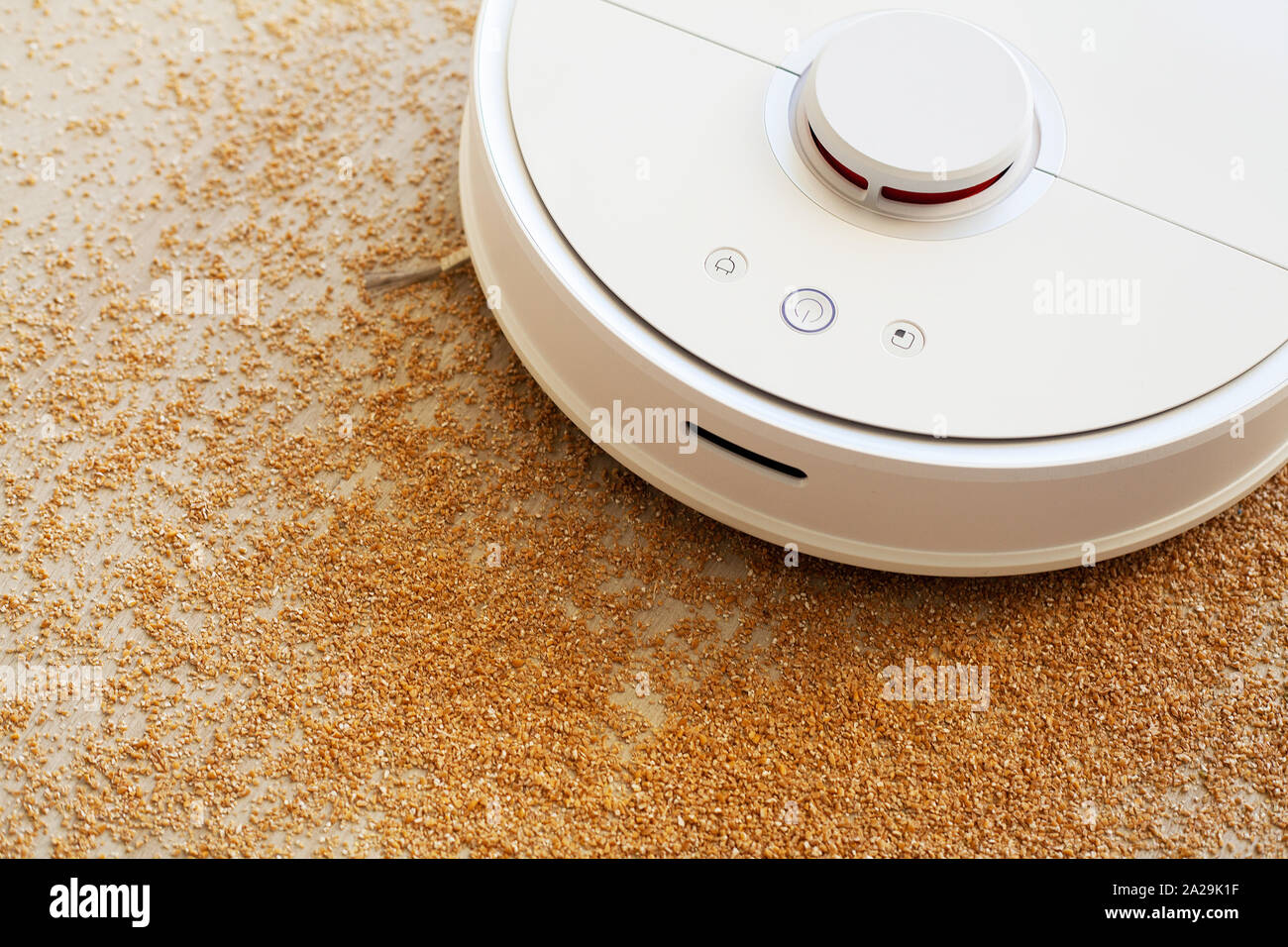 Smart home. Robot vacuum cleaner performs automatic cleaning of the