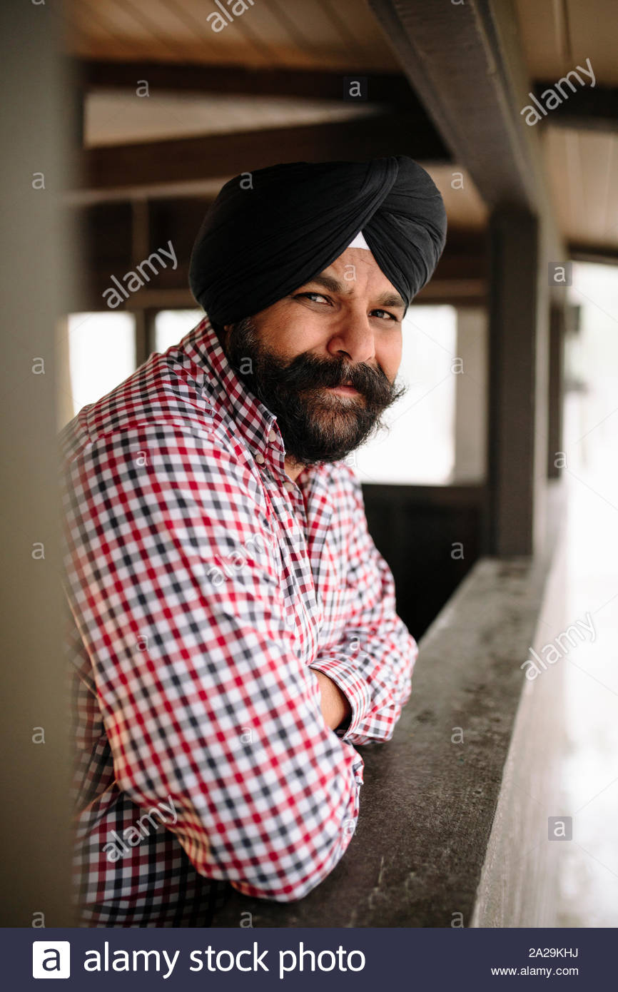Portrait of mature Indian man wearing turban looking at camera Stock Photo