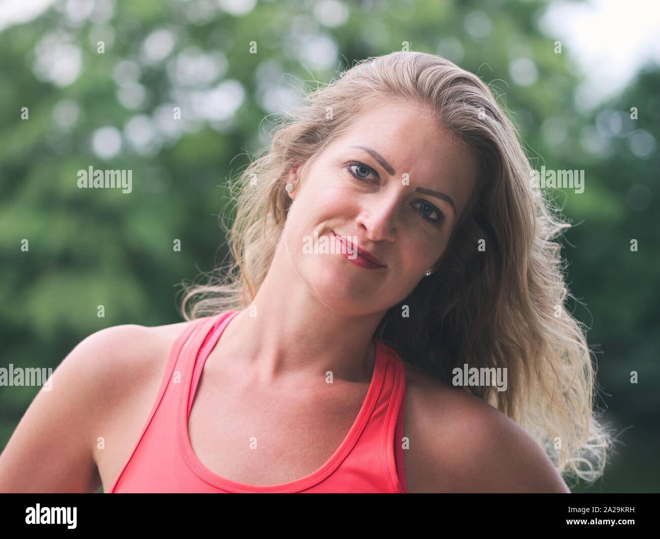 Portrait of a Sporty Woman in her Thirties in the Park Stock Photo