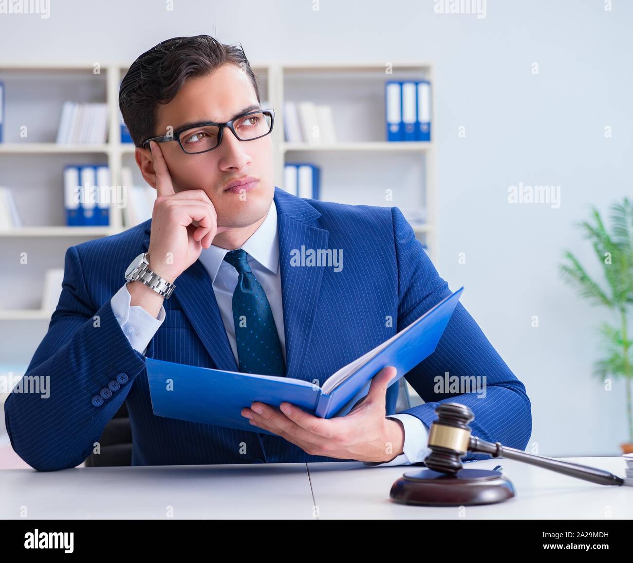 The young lawyer judge sitting in the office Stock Photo Alamy