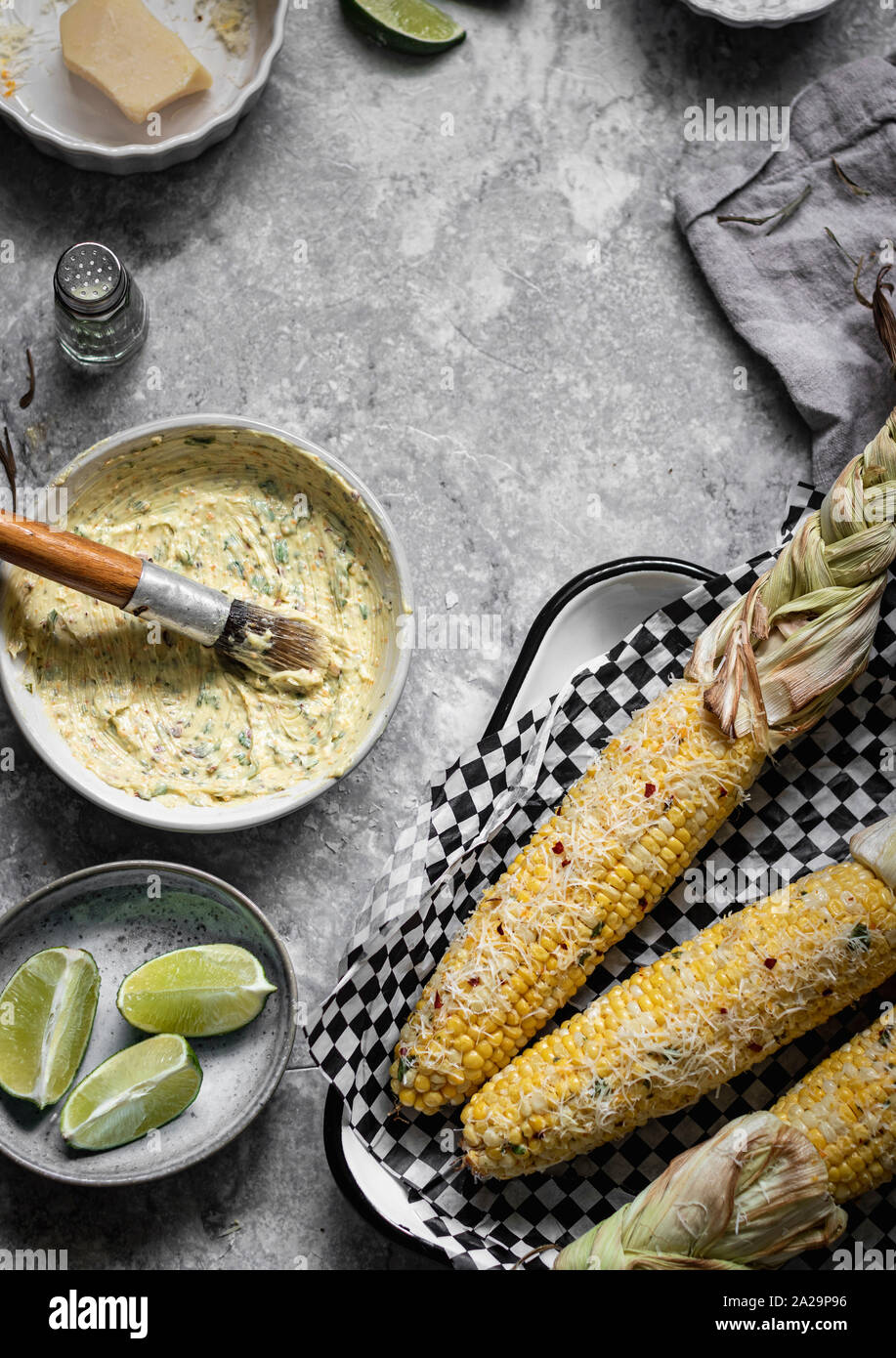 Mexican street corn on the cob. Ingredients off to the side herbed
