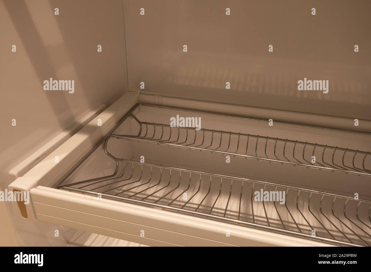 Extendable shoe basket Inside the wardrobe. Modern shoe storage solution Stock Photo Alamy