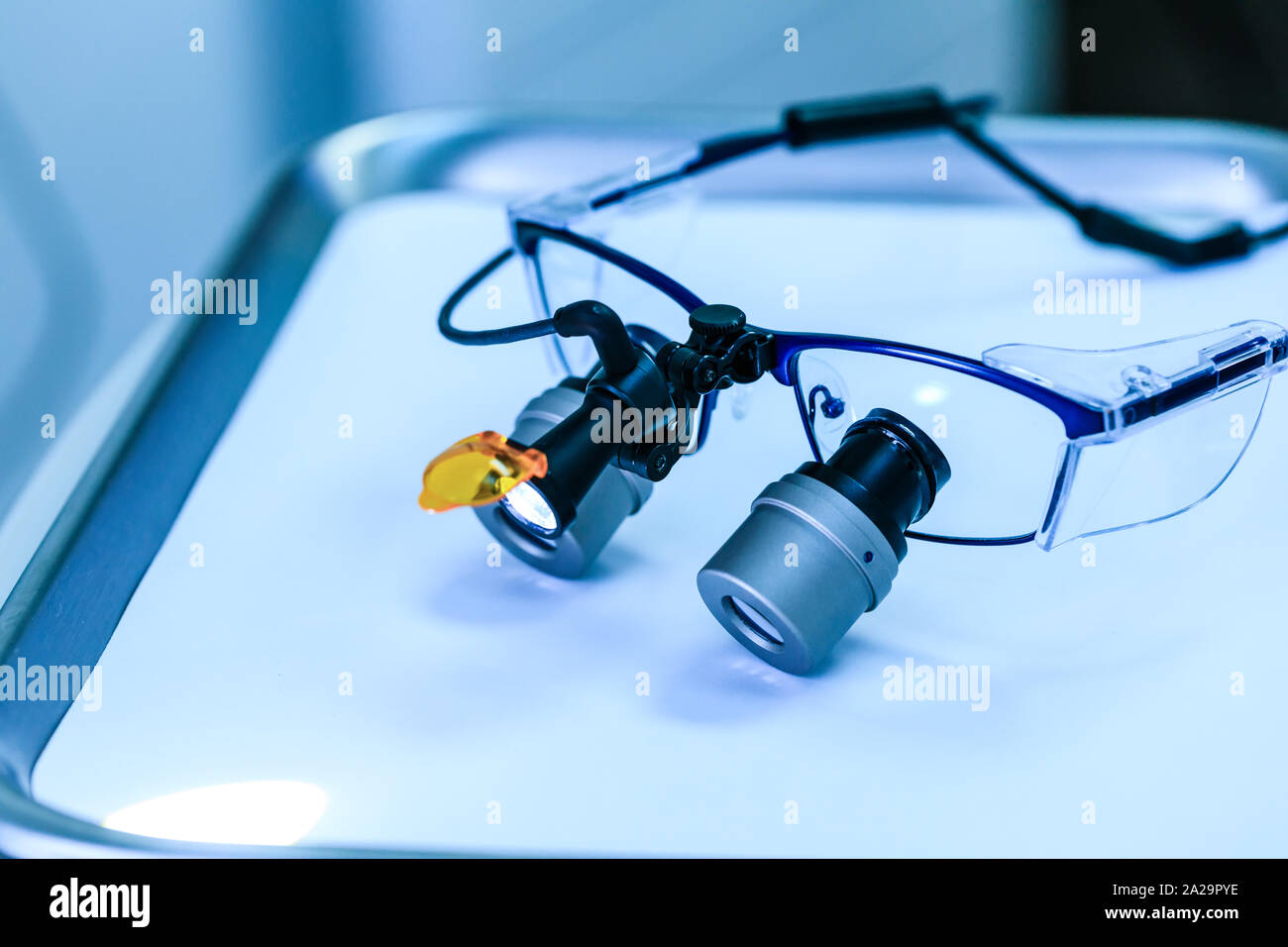 Dental medical glasses with binocular lenses, in dentistry clinic