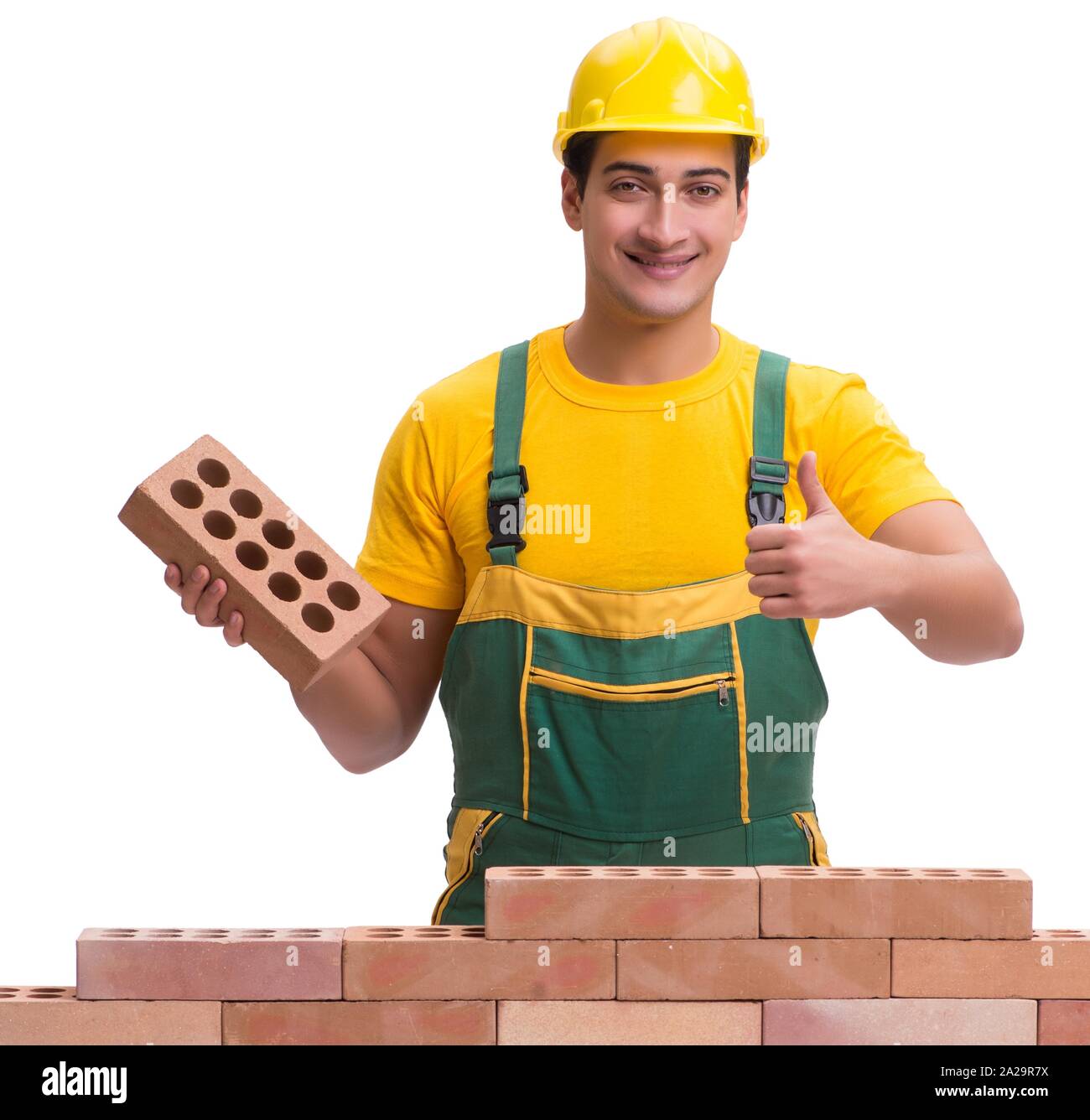 The the handsome construction worker building brick wall Stock Photo ...