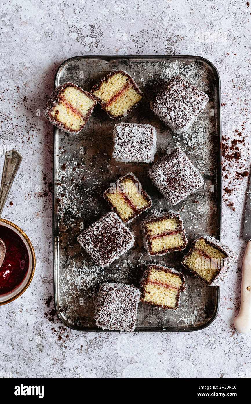 Lamingtons with strawberry jam Stock Photo Alamy