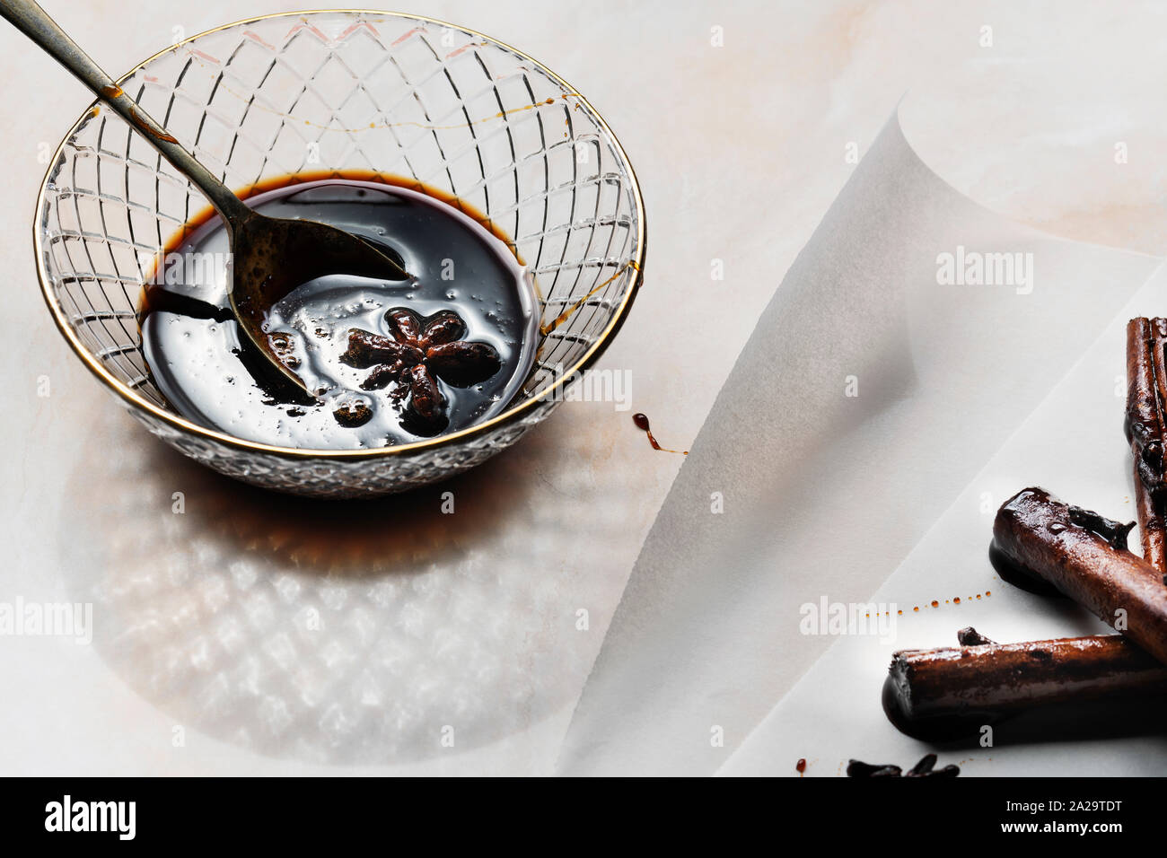 Star of anise in spicy chai syrup Stock Photo Alamy