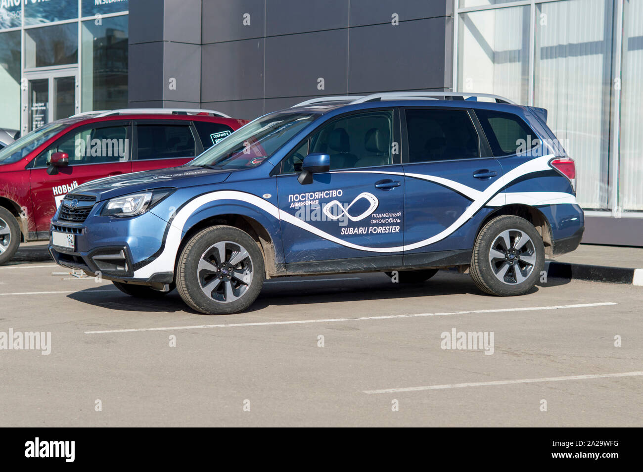 Dealer Center - Mitsubishi. The sample for test driving in the city. Car Mitsubishi OUTLANDER. Russia Stock Photo