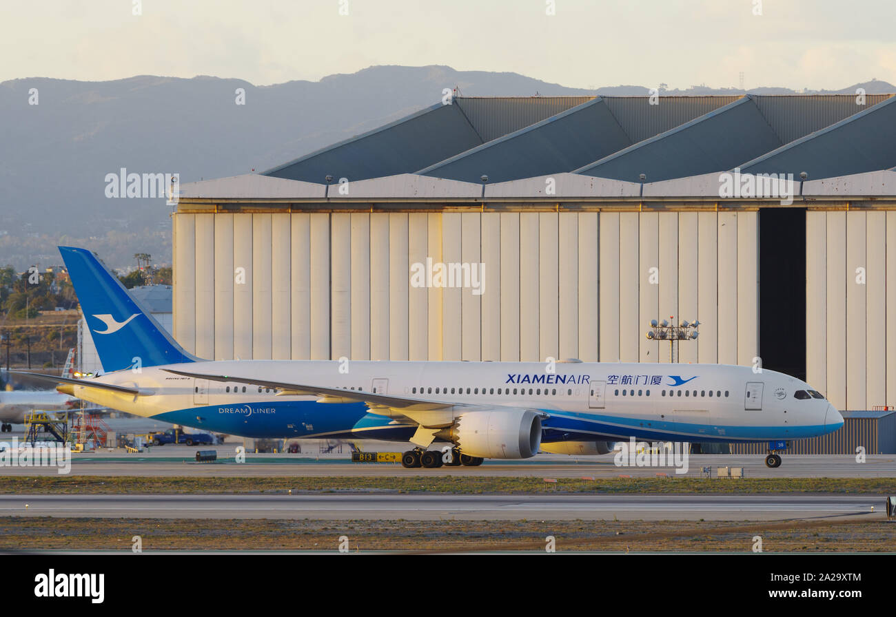 Image of XiamenAir Boeing 787 (Dreamliner) shown taxiing at the Los Angeles International Airport, LAX. XiamenAir is a Chinese passenger airline. Stock Photo