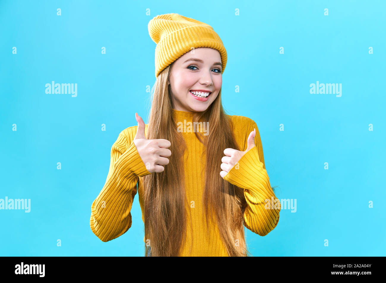Happy excited woman smile holding thumbs up gesture, beautiful young ...