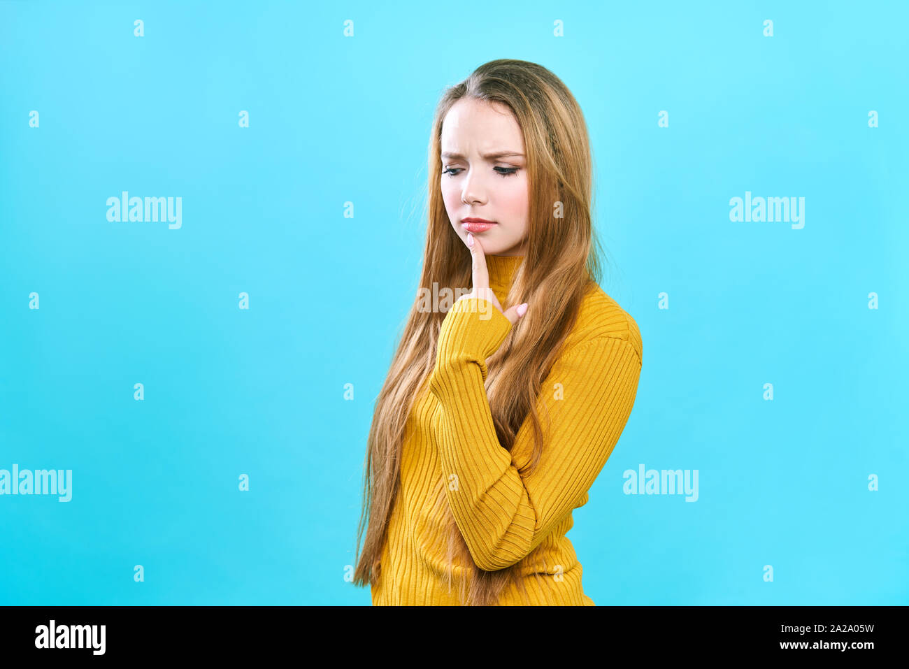 Portrait of a beautiful young caucasian female student with long blond