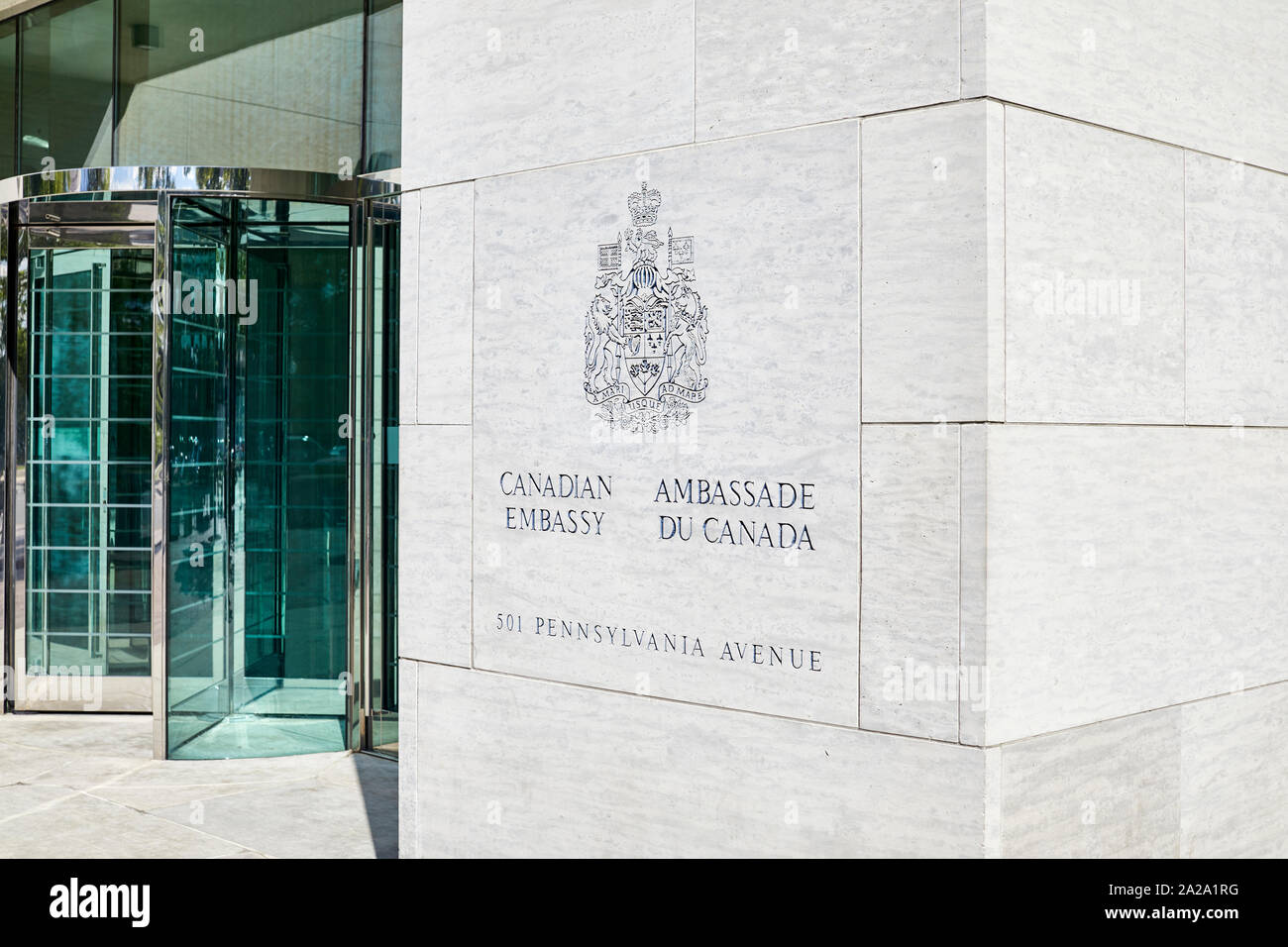 Washington DC, USA - September 18, 2019: Sign on the wall of the Canadian Embassy with revolving glass door entrance Stock Photo