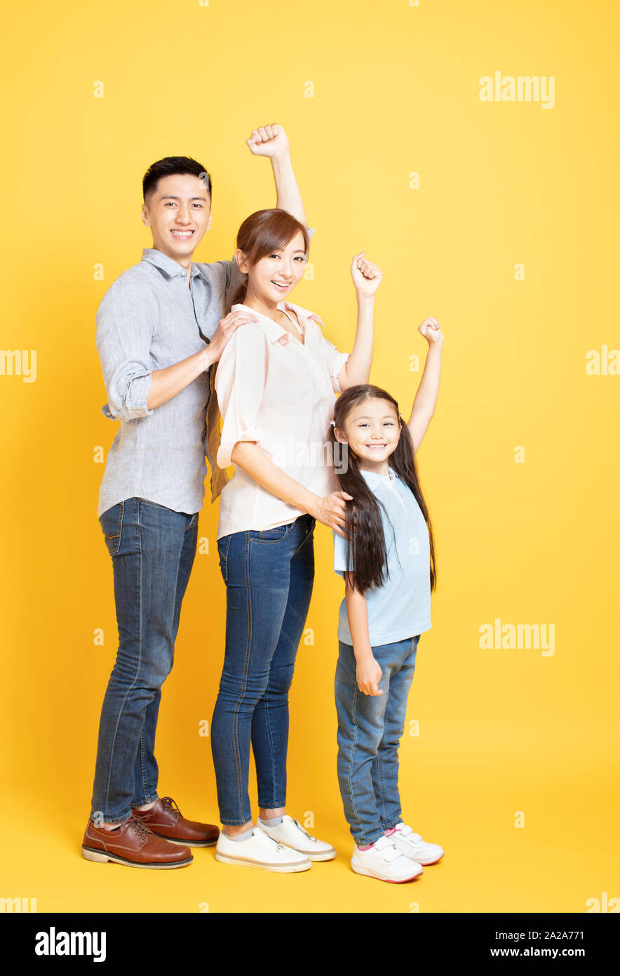 full length of Happy asian young Family Stock Photo