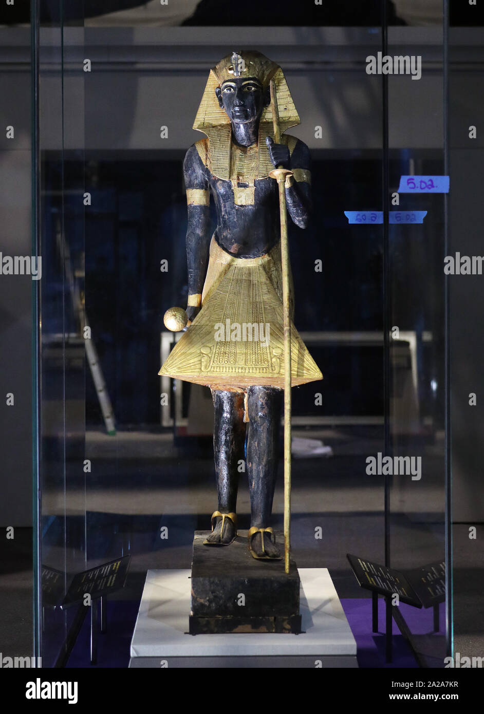 A wooden guardian statue ka king wearing nemes headcloth hires stock