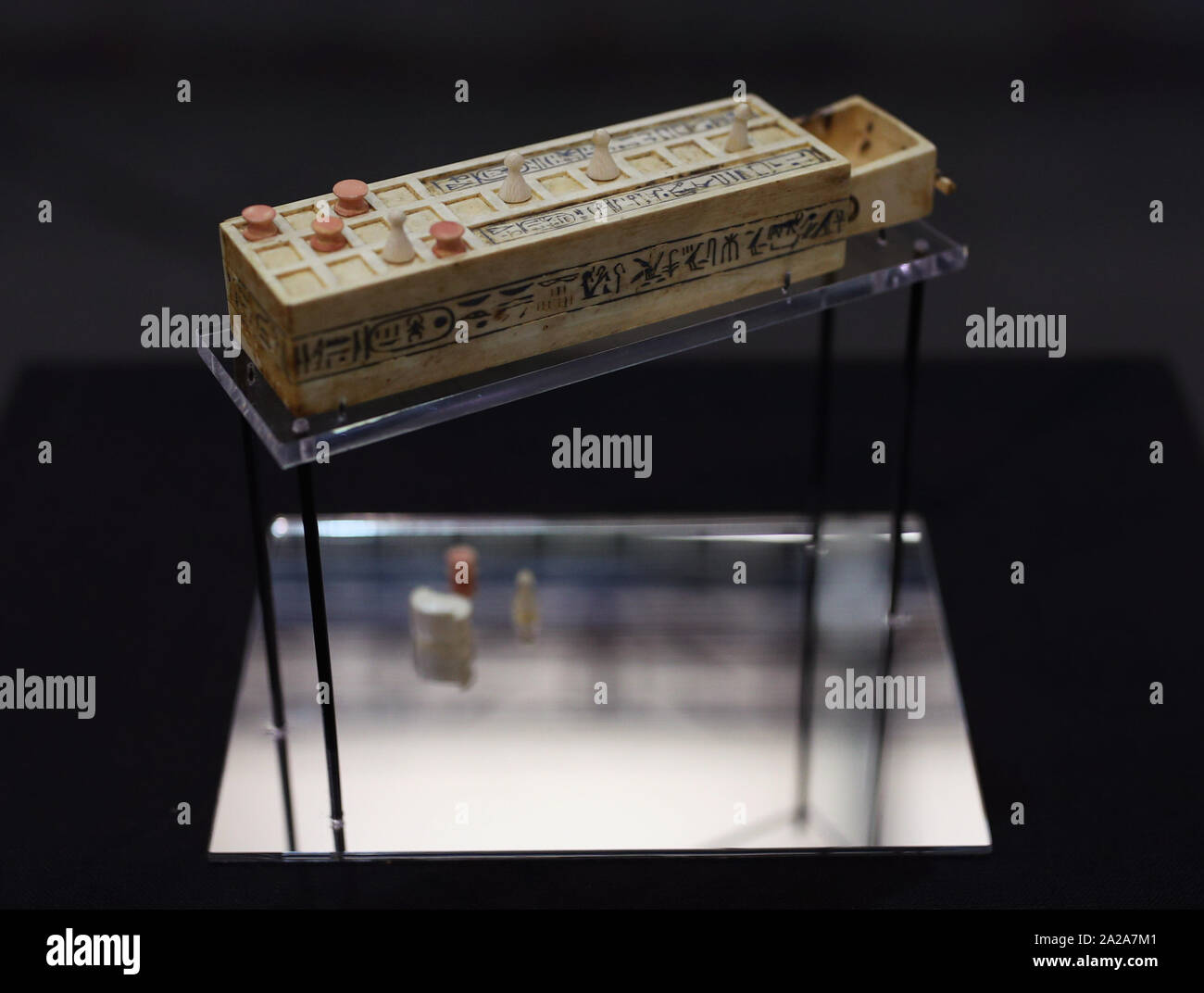 A miniature senet game board - where players moved five discs and five cone pieces across the board and threw knuckle bones to determine their moves - dated to the reign of Tutankhamun 1336-1326 BC, on display in Paris ahead of being packed up after the closure of the exhibition ‘Tutankhamun: Treasures of the Golden Pharaoh’, which is heading to the Saatchi gallery in London to open November 2. Stock Photo