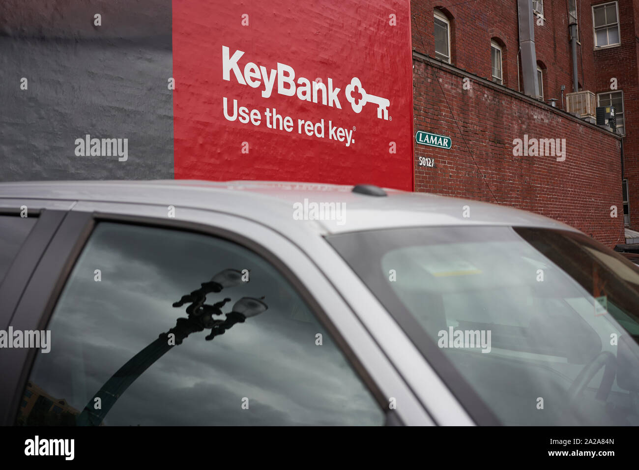 Portland, Oregon, USA - Sep 27, 2019: A KeyBank poster is seen on a side of a building from a parking lot in downtown Portland. Stock Photo