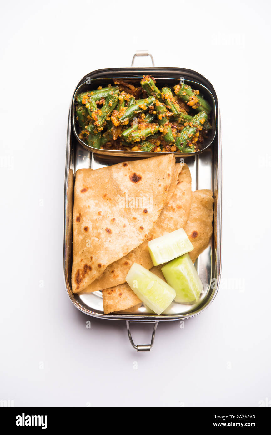 Lunch Box / Tiffin for Indian kids, includes beans vegetable sabzi with roti or chapati, selective focus Stock Photo