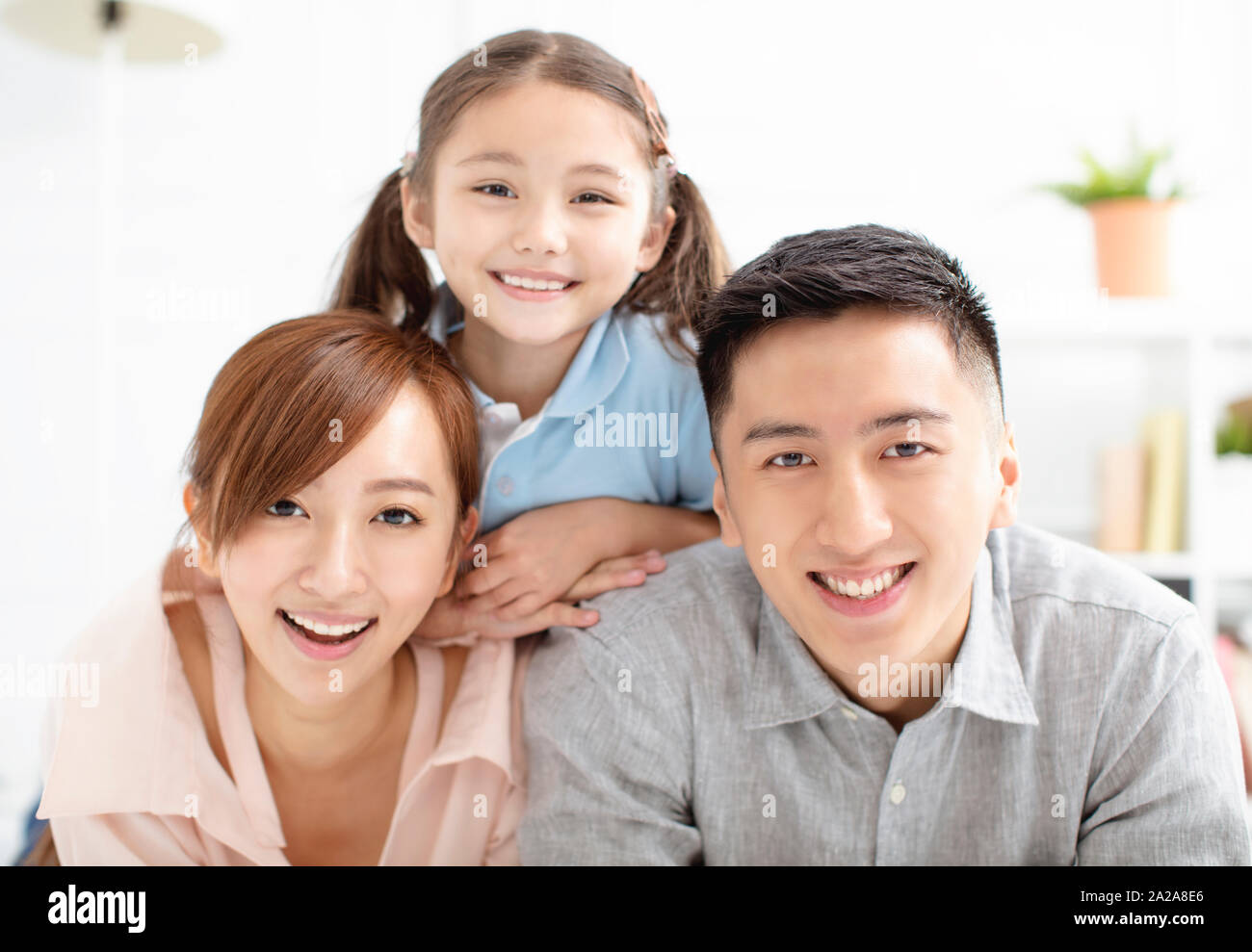 Happy family and child having fun together Stock Photo