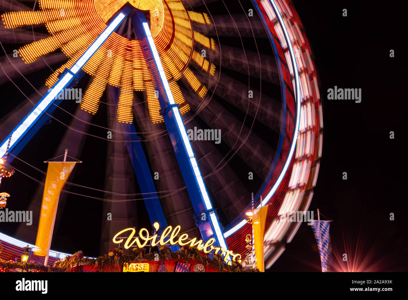 Munich, Germany - 2019, September 19: long exposure of the biggest ferris wheel at the Oktoberfest in Munich at night Stock Photo
