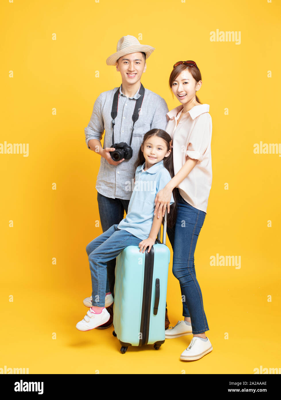 happy family with suitcase going on summer vacation Stock Photo