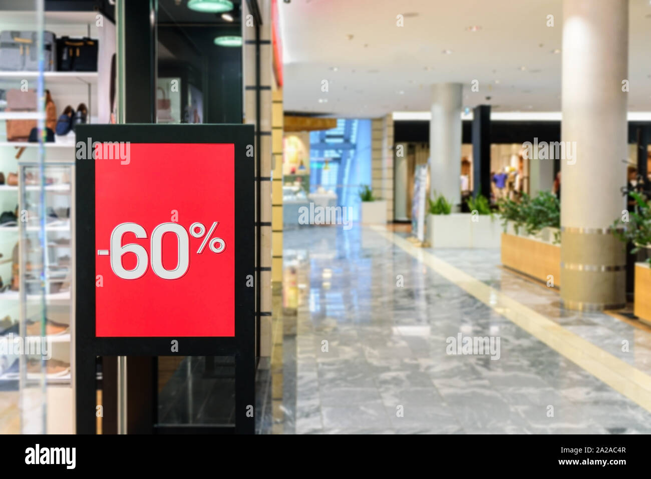 Red Sale sign in shopping mall. Seasonal sale. Nobody Stock Photo