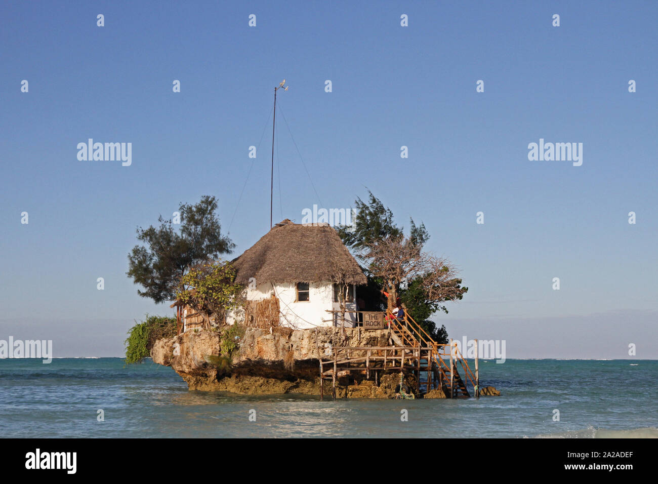 View of The Rock restaurant islet from the Zanzibar beach, Zanzibar, Unguja Island, Tanzania. Stock Photo