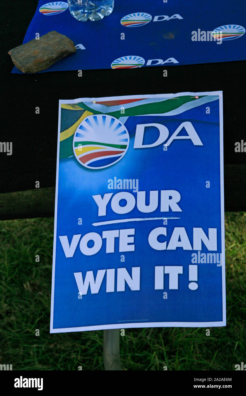 Democratic Alliance poster and voting booth on table in a park, Lynwood, IEC Pretoria voting station, Border road East, Lynwood, Pretoria, Gauteng Province, South Africa. Stock Photo