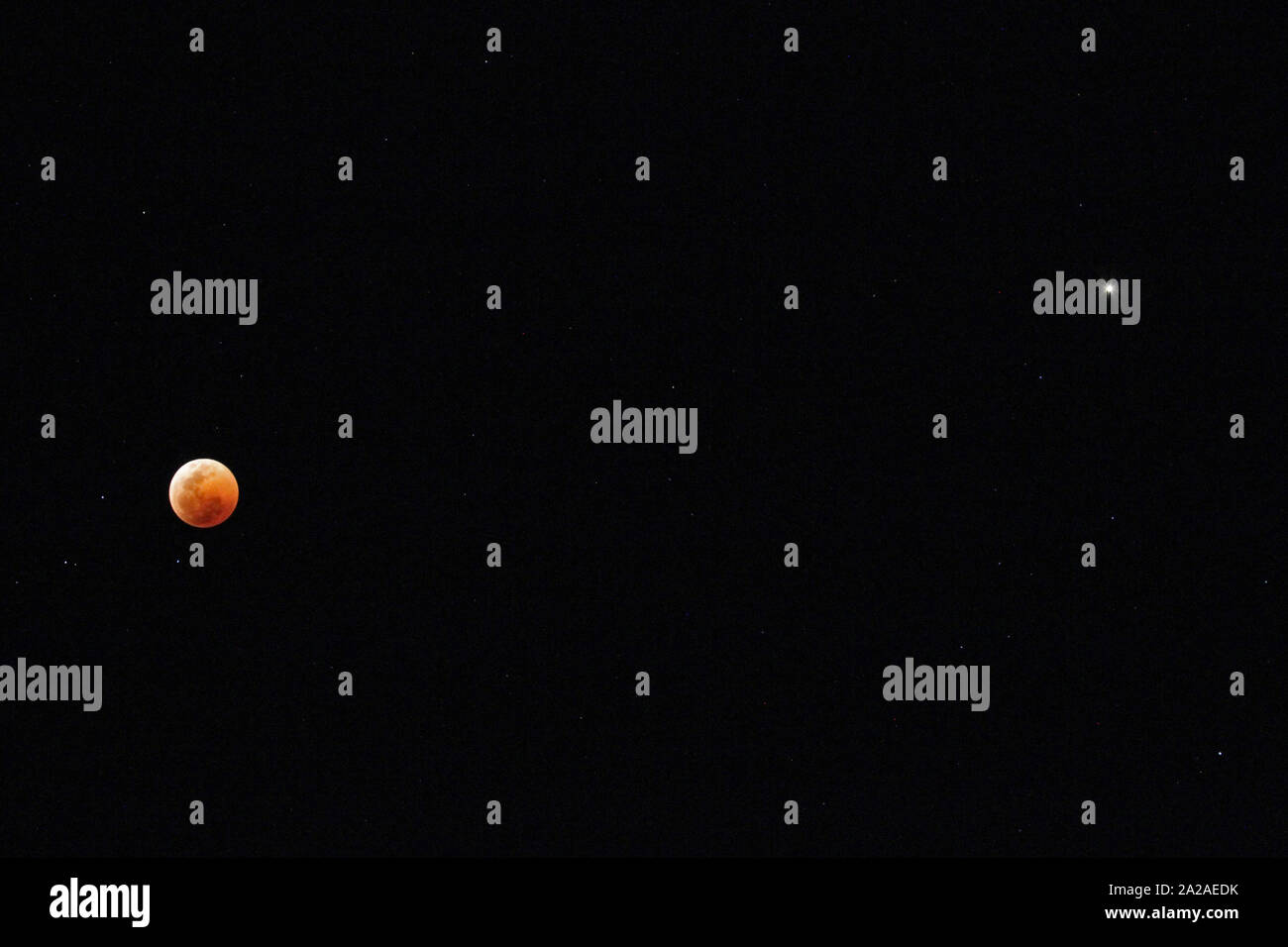 Blood moon lunar eclipse next to mars against night sky, Moreleta Park