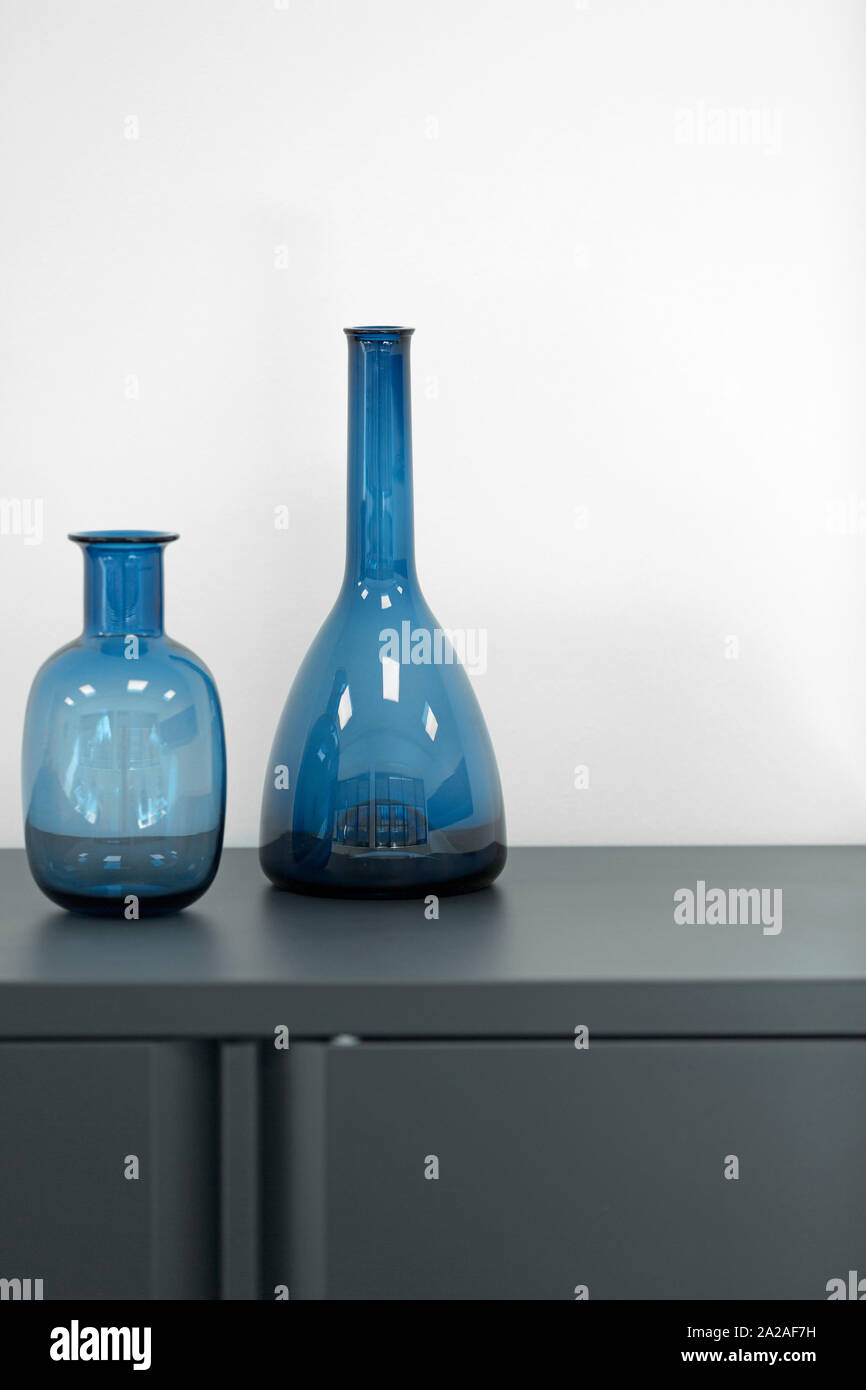 Two blue decorative vases on an office filing cabinet Stock Photo