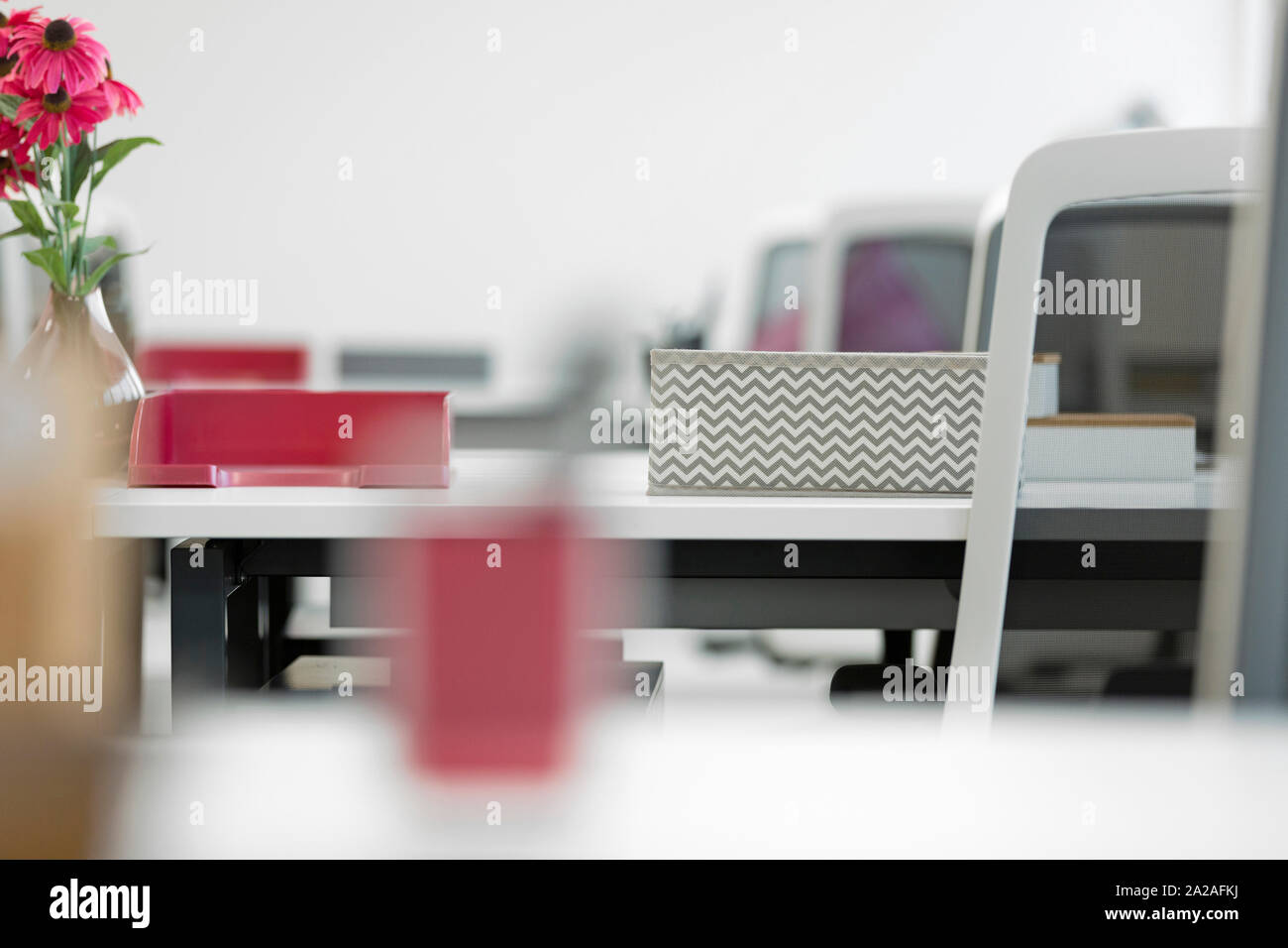 Row of modern office desks and chairs Stock Photo Alamy