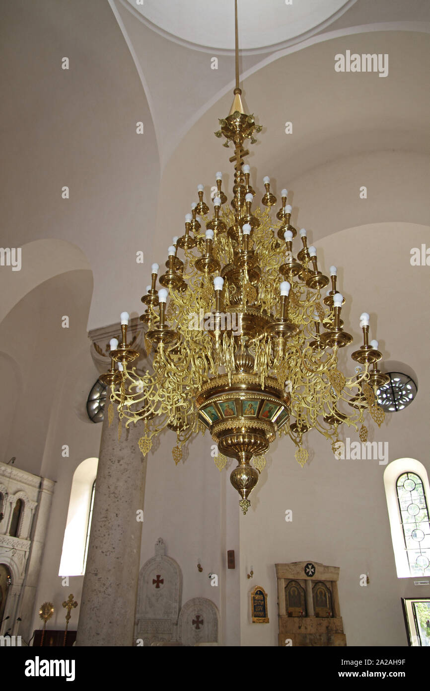 Golden chandelier on the ceiling in the interior of The Alexander Nevski Serbian Orthodox Church, Belgrade, Serbia. Stock Photo