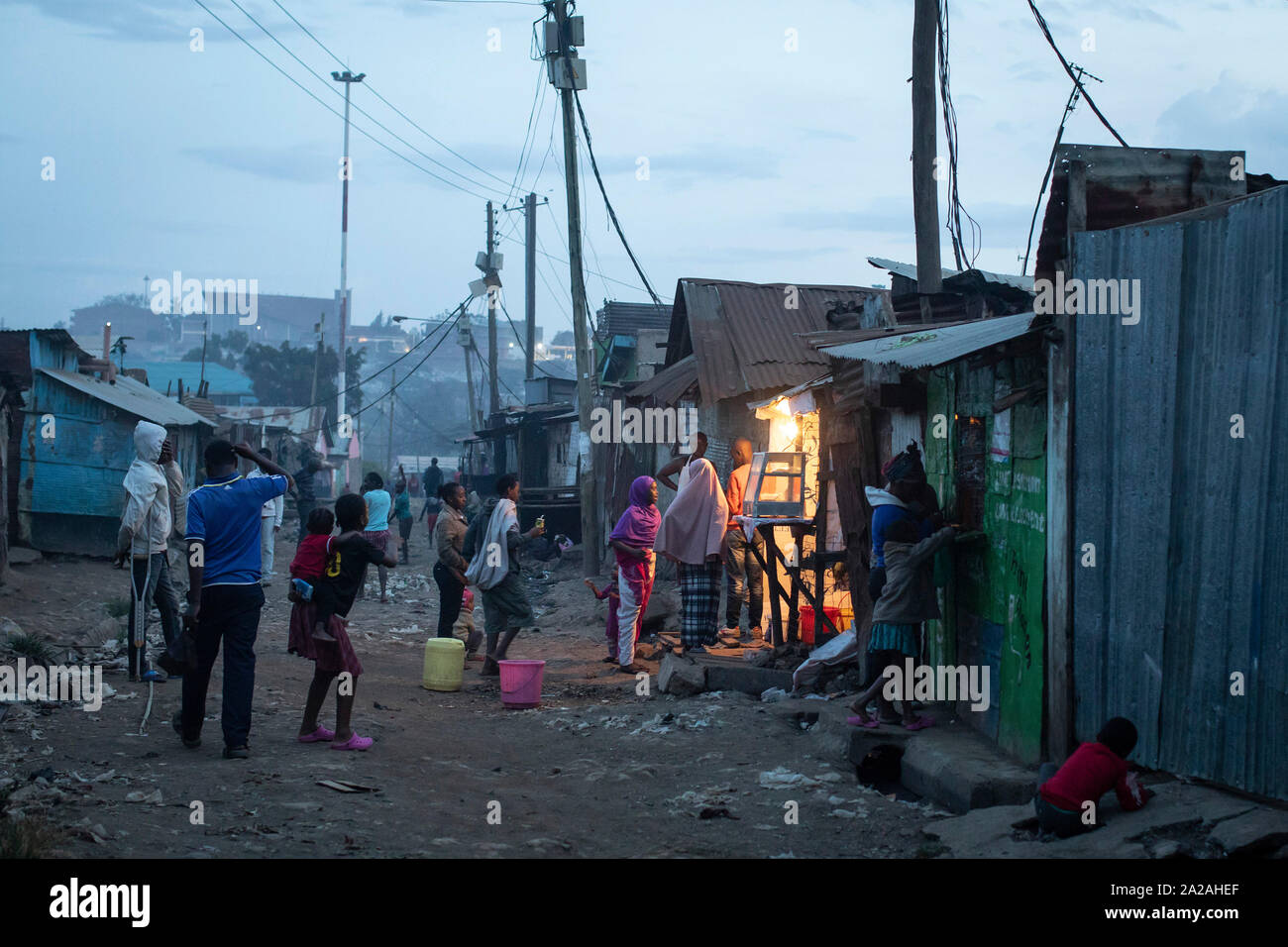 Residents queue to buy food from a kiosk in the slum of Korogocho close to the Dandora rubbish dump in the capital Nairobi, Kenya, February 20, 2019. Stock Photo