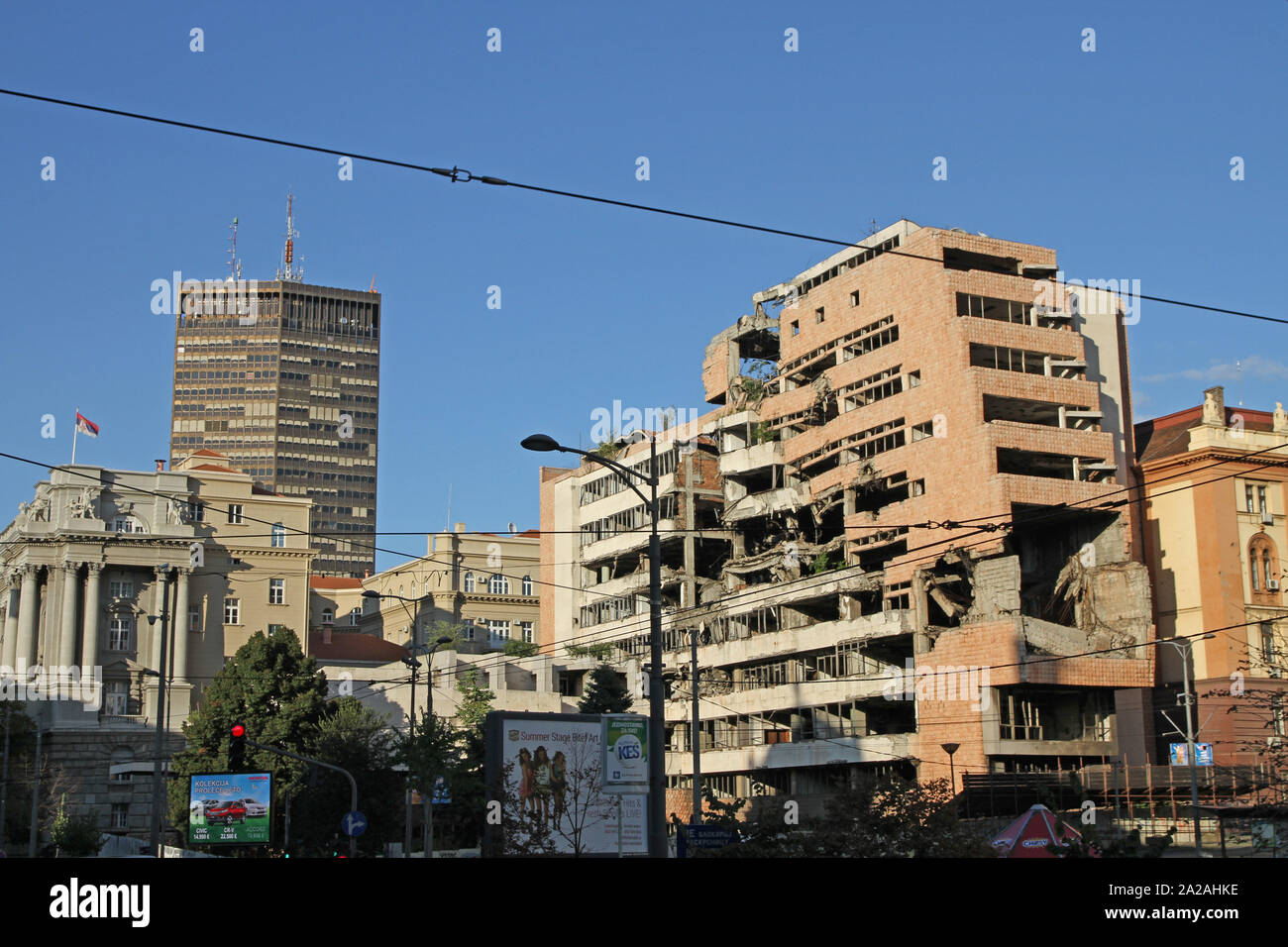 Remains of The Former Yugoslav Ministry of Defence and the Former Yugoslav Ministry of Defense with the Belgrade Palace skyskraper in the background, Belgrade Central, Serbia. Stock Photo
