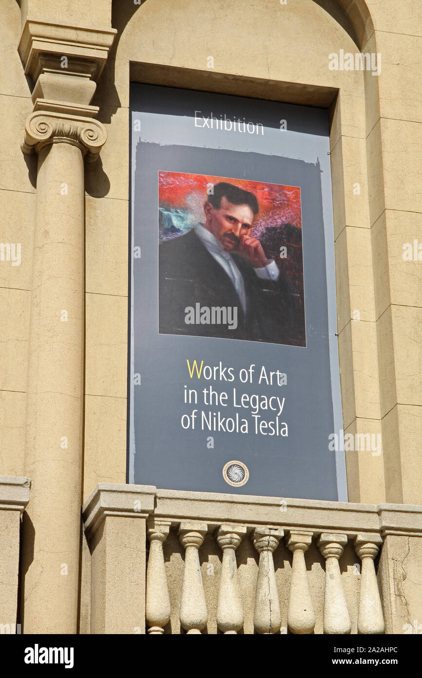 Poster advertising Works of Art in the legacy of Nikola Tesla Exhibition on the front facade of the Nikola Tesla Museum, Central Belgrade, Serbia. Stock Photo