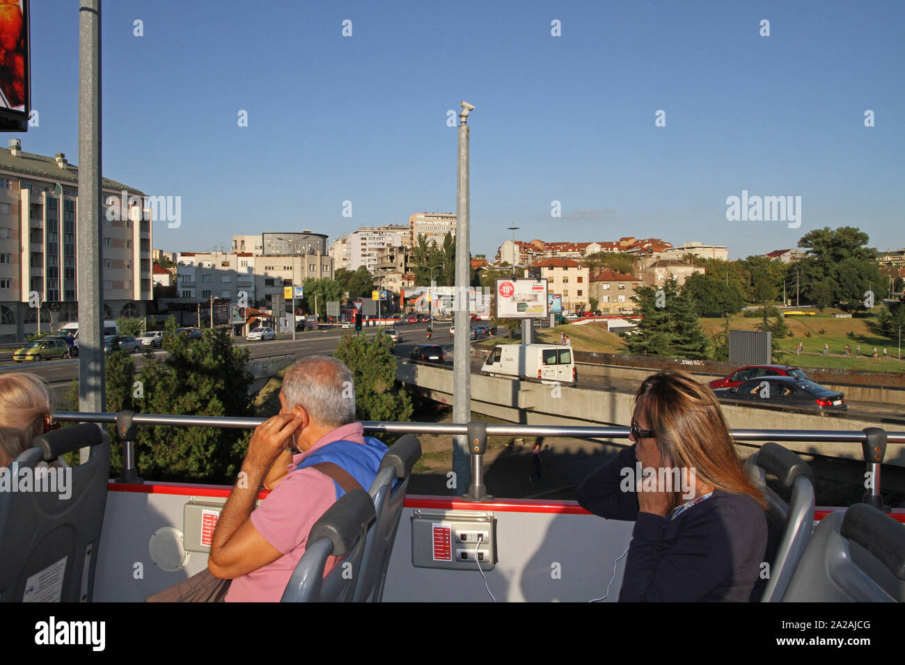 Passengers sitting in the top deck of a touring bus on highway, Belgrade, Serbia. Stock Photo