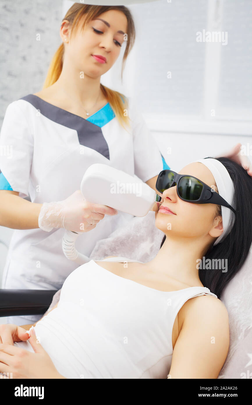 Body Care. Underarm Laser Hair Removal. Beautician Removing Hair Of