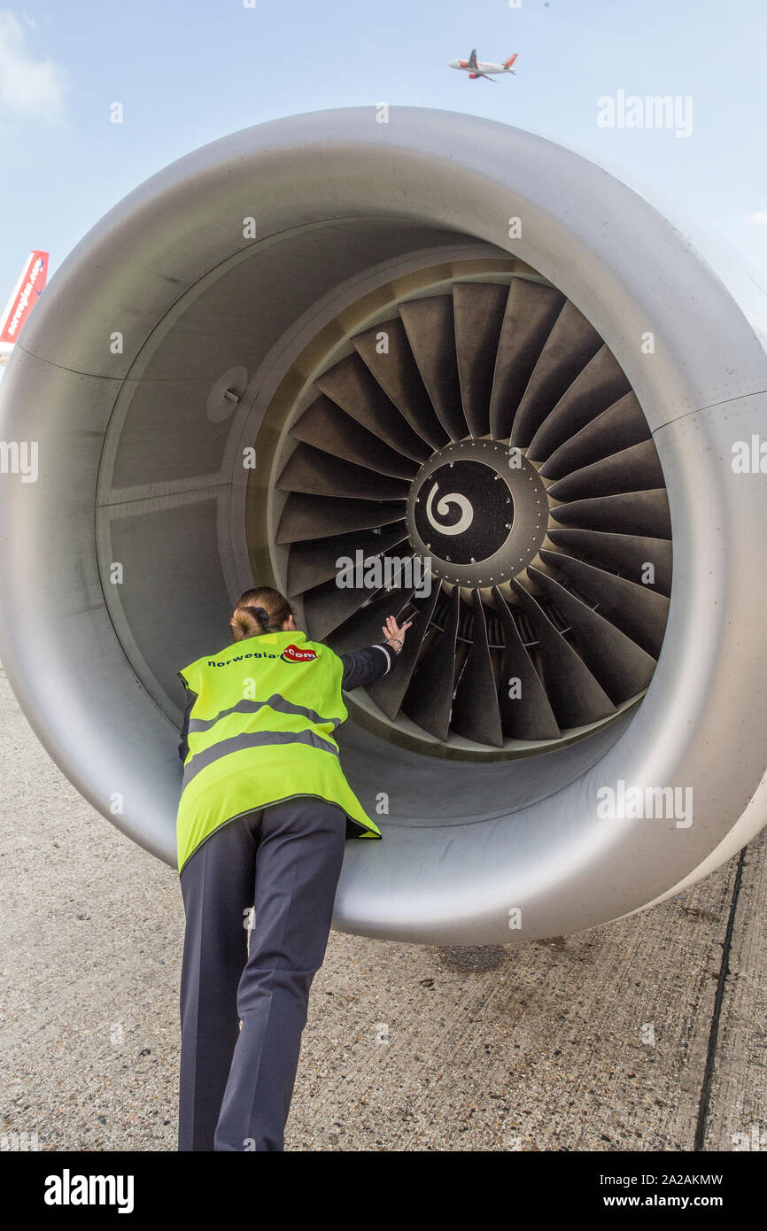 pilot doing pre flight checks and walk around Stock Photo