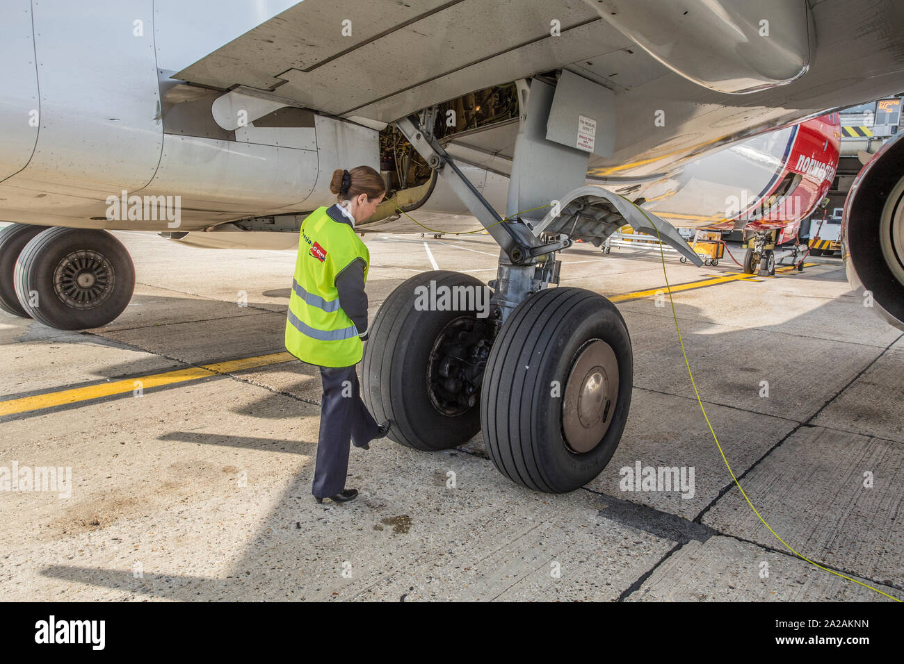 pilot doing pre flight checks and walk around Stock Photo