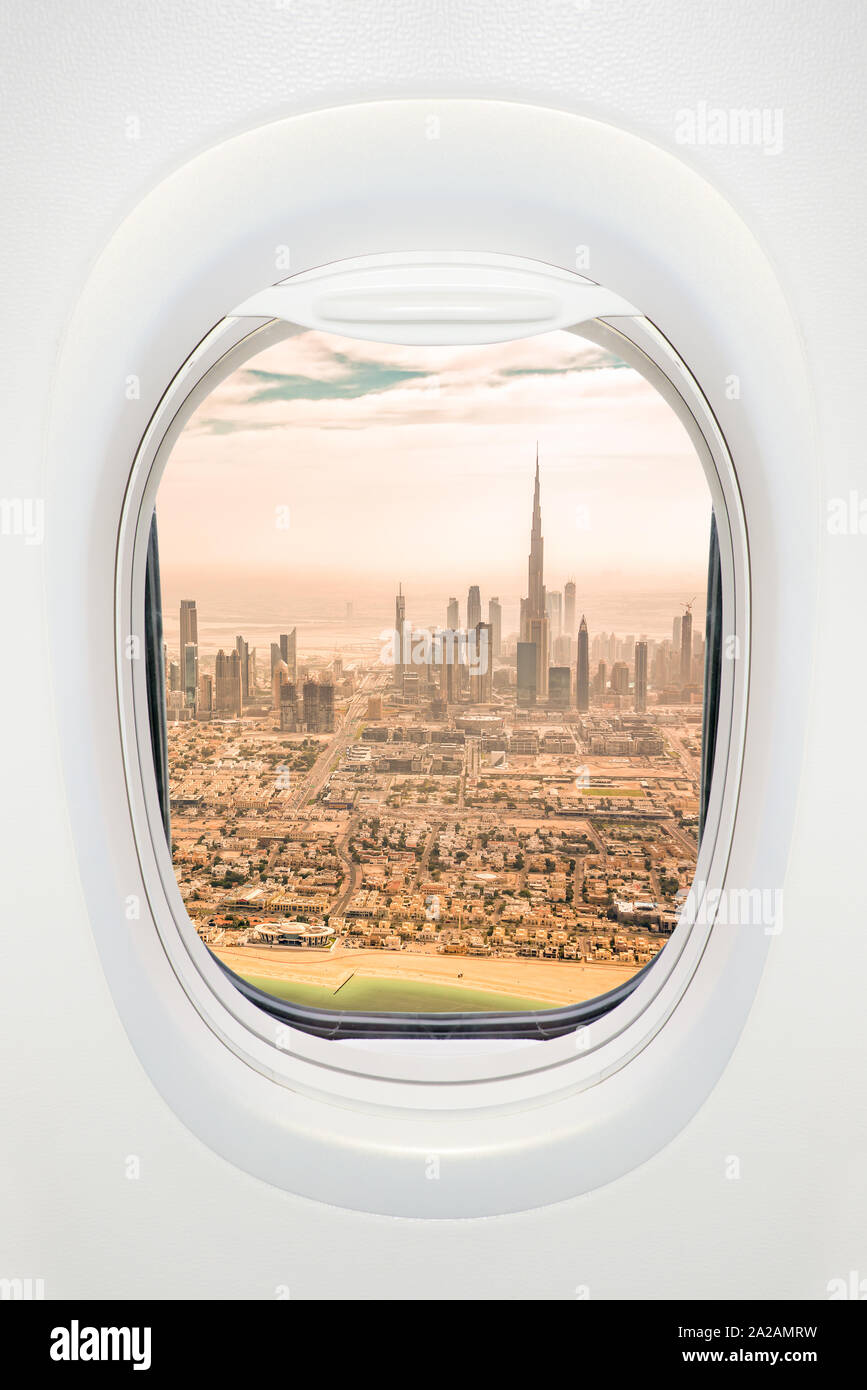 Dubai seen through the window of airplane, travel in UAE concept Stock Photo