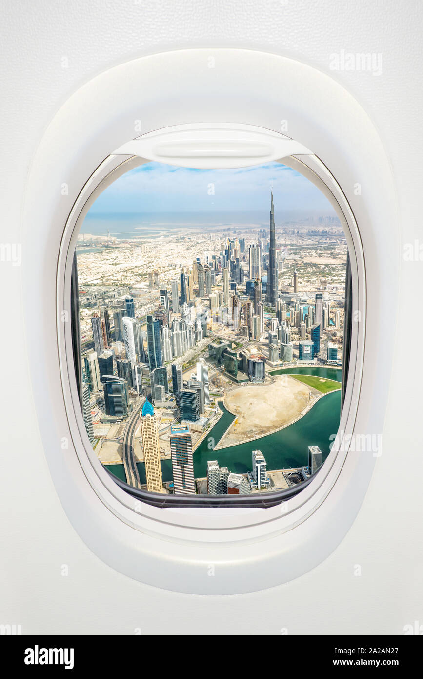 Dubai seen through the window of airplane, travel in UAE concept Stock Photo