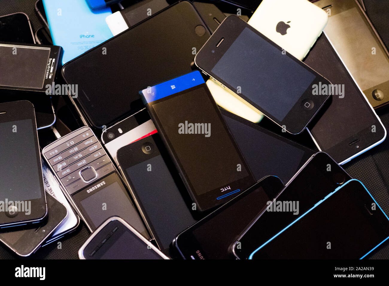 Mobile phones in a pile Stock Photo
