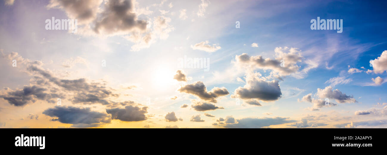 Colorful sky with with sun and clouds as background Stock Photo - Alamy