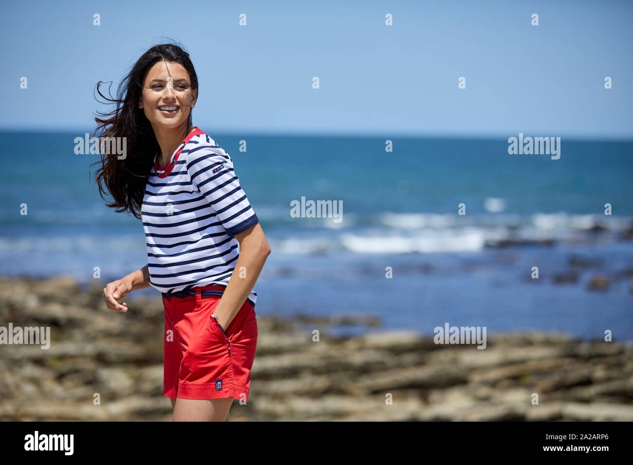 Young woman by the sea, Route de La Corniche, Cantabrian Sea Coast, Hendaye, Aquitaine, Basque Country, France Stock Photo