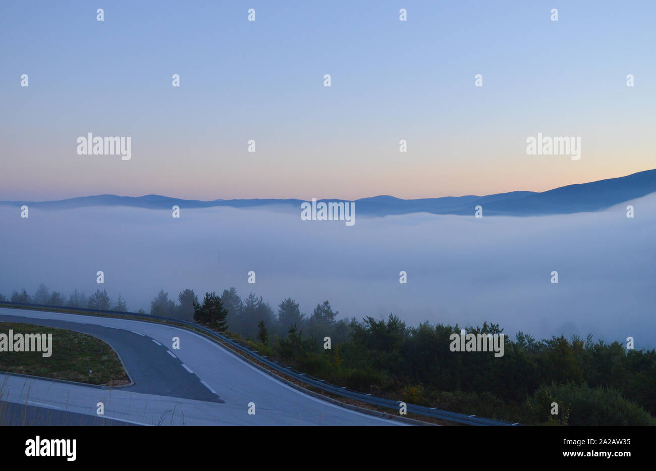 Sunrise over Gacka valley covered with fog Stock Photo