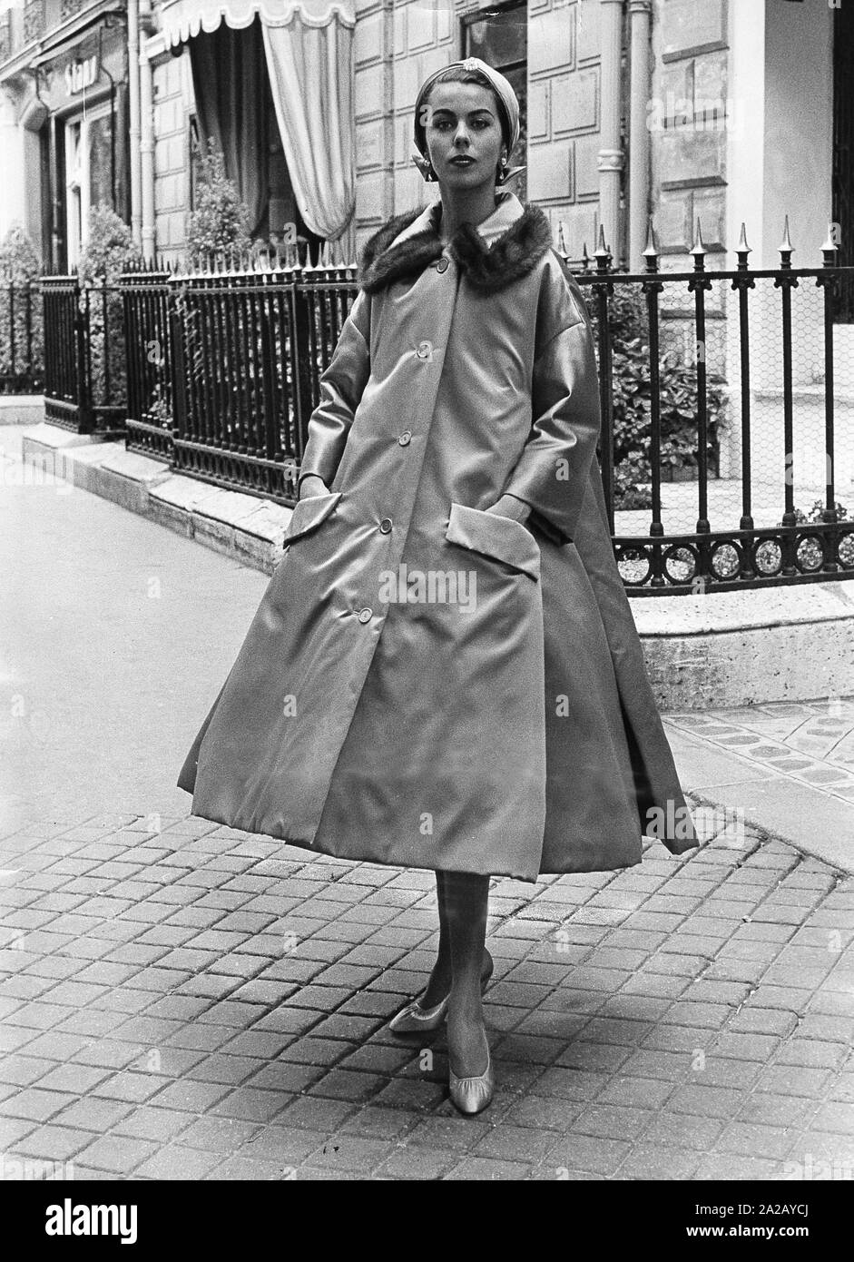 Woman in a long 'Soiree de Bagdad' coat. Stock Photo